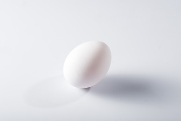 White egg with shadow isolated on white background