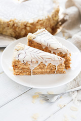 Esterhazy cake sliced on white plate close-up