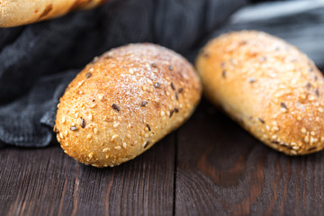 Fresh bread on table. Homemade bread. Kitchen or bakery poster design. Bread background