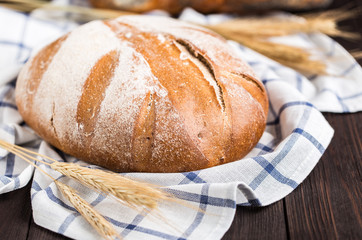 Fresh bread on table. Homemade bread. Kitchen or bakery poster design. Bread background