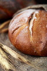 Fresh bread on table. Homemade bread. Kitchen or bakery poster design. Bread background