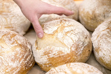 Hand reachning for bread in the store © jollier_