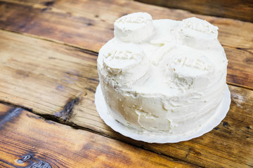 Homemade birthday's white cake for 7 year-old boy Round cake in brick shape. Right on photo