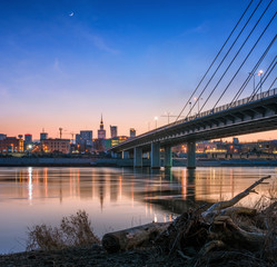 Fototapeta premium Warsaw Skyline by Night from under the Bridge. Panorama Warszawy.