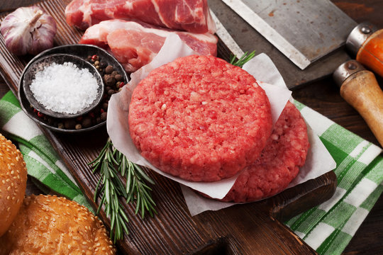 Raw minced beef meat and ingredients for burgers