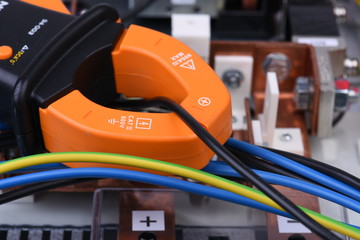 Clamp meter measure current on cable on power supply devices