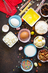 Ingredients for Easter baking - cottage cheese, nuts, eggs, flour, yeast, butter, raisins and sugar. Flat lay. Top view with copy space.
