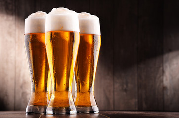 Composition with three glasses of lager beer