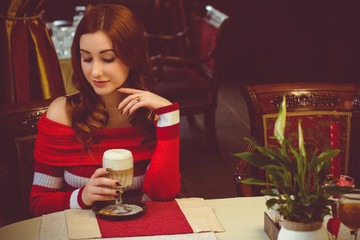 Image of serene girl sitting in cafe and thinking about something. Lady with coffee in restaurant. Stylish glamorous lady at vacation. Retro style. Concept of women's secret 
