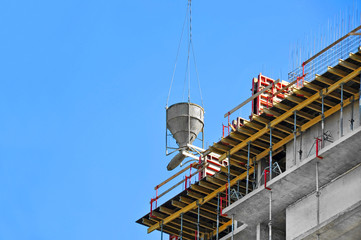Naklejka premium Crane lifting cement mixing container