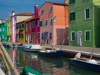 Fototapeta na wymiar Colorful homes on the canal in Burano Italy