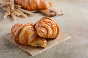 Fresh Croissants on brown concrete background Selective focus Copy space