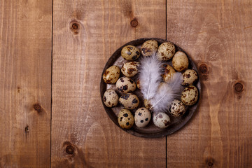 Eggs on plate on wooden table. Top view, text space