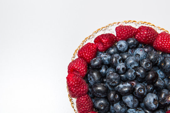 fresh blueberry and rasberry on white background