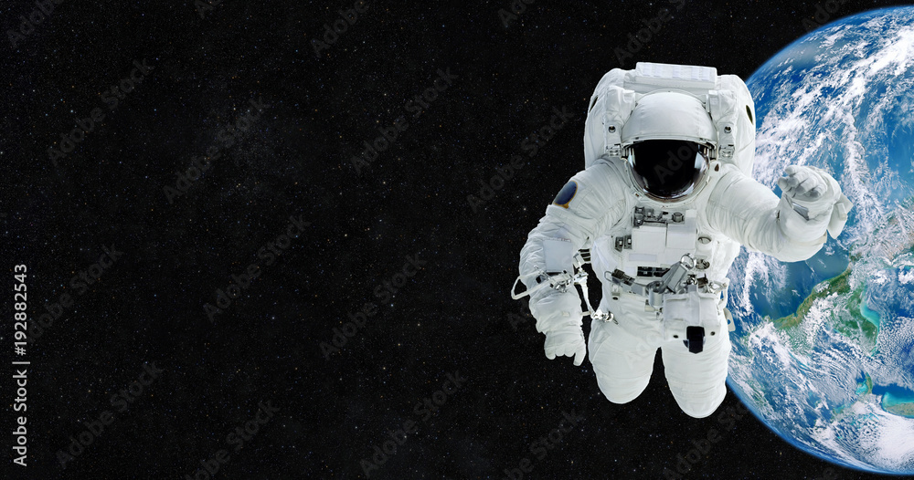 Aufkleber Astronaut in an outer space against the backdrop of the planet earth. Spaceman begins to travel. Elements of this image furnished by NASA.