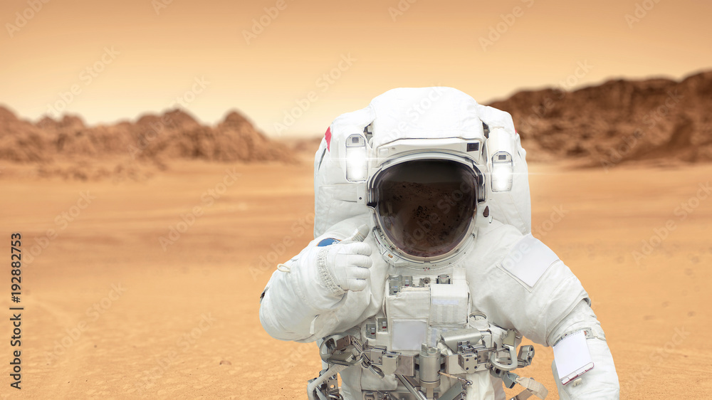 Poster humans on the planet mars. astronaut on mars shows a thumbs-up. landscape of the red planet mars. sp