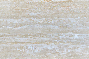 Closeup texture of a beige stone. Close-up of macro photography architecture.
