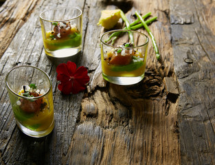 Snack from salmon and puree from avocado in a glass. Film effect