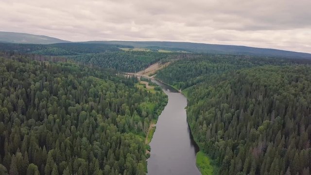 Gorgeous aerial panoramic view on the touristic part of the river at sunset. Clip. Beautiful natural landscape at summer. Europe