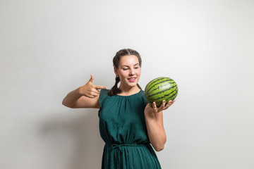 Diet concept. Young woman selects food for breakfast