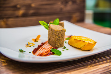 Food on a plate, on a wooden background.Food detail