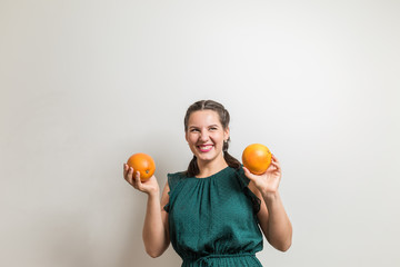 Beautiful young smiling student takes fruits for dinner