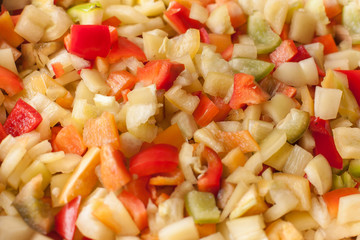 cut slices pieces of red, yellow and green sweet bell pepper macro closeup