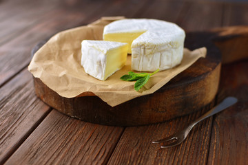 Cheese on a wooden background. Natural and healthy food concept.
