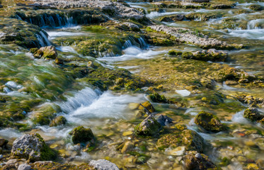 Fototapeta na wymiar A picturesque stormy river flows through the city of Mostar.