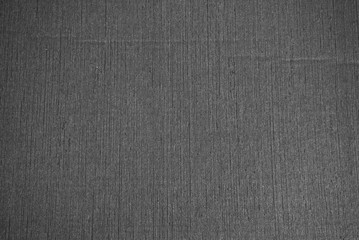Fototapeta na wymiar Textured paper background in dark gray colors.