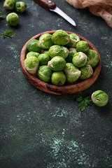 Brussels sprouts on green concrete background