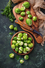 Brussels sprouts on green concrete background