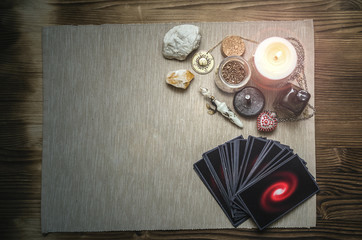 Tarot cards deck on fortune teller desk table background with copy space. Future reading concept.