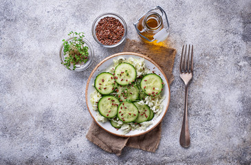 Healthy spring salad with cucumber, flax seed and cress 