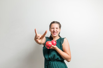 Pretty young teenager is crazy about fruits