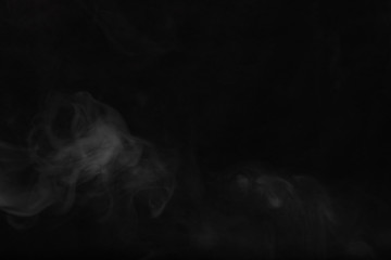 White smoke on a black background. Texture of smoke. Clubs of wh