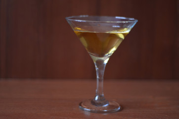 Martini cocktail on dark stone table. With space for your text