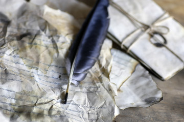 old paper letter feather