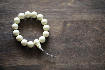 Beads and Incense on wooden table
