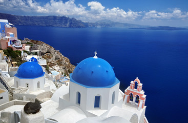 Blue dome church of beautiful Oia in Greek Island of Santorini,  Greece