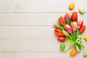 Spring easter tulips in bucket on white vintage background.