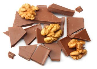 cracked chocolate candies sweets with nuts isolated on white background top view