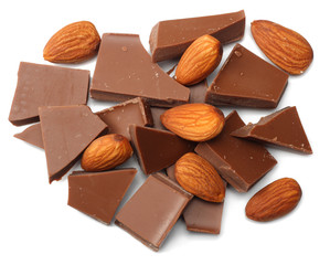 cracked chocolate candies sweets with nuts isolated on white background top view