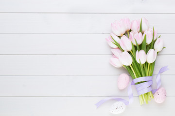Pink pastel color tulip on the white background. Easter background.