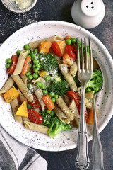 Whole wheat penne pasta with vegetables.Top view.