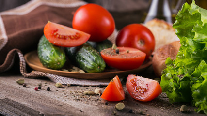 tomato, cucumber, lettuce, baguette and spices