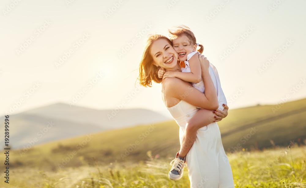 Canvas Prints Happy family in summer outdoors.   mother  hug child daughter and laughing