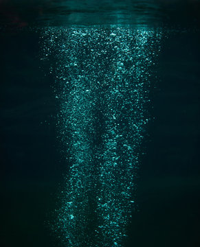 Close Up Of Air Bubbles In The Water On Dark Background