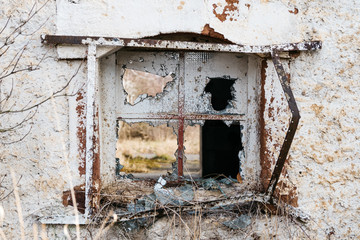 A broken window on an old house