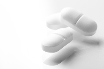 Pharmacy theme, white medicine tablets antibiotic pills.